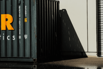 watertight shipping container sitting through the rain on a concreate ground